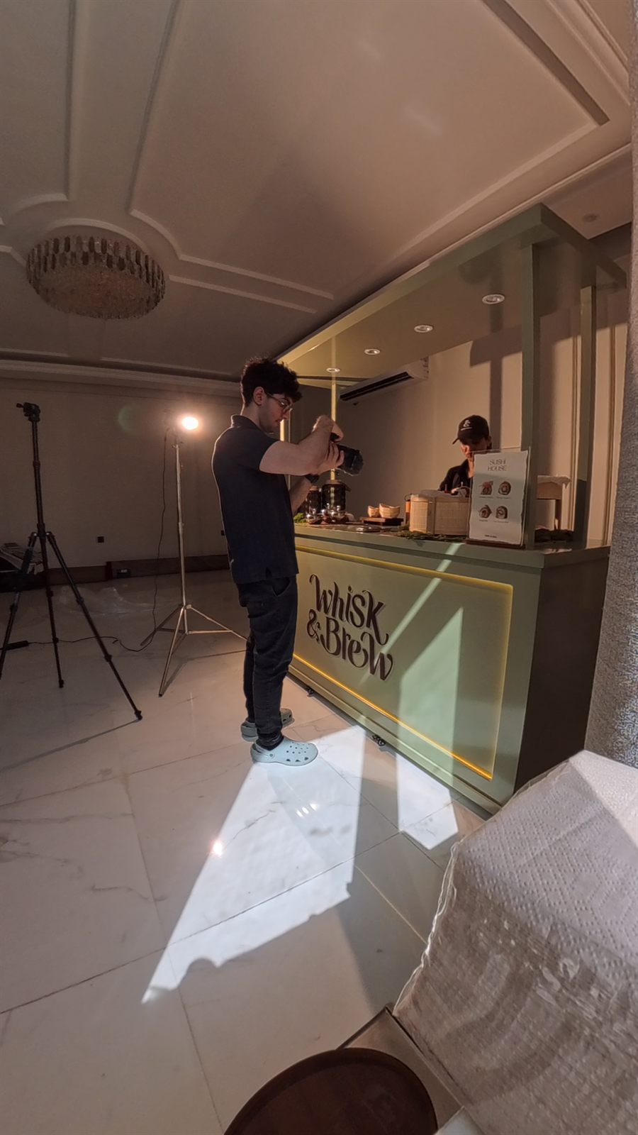 Qissahh videographer filming at the Whisk and Brew cart