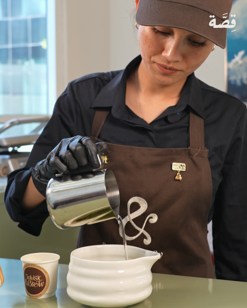 Whisk & Brew barista pouring matcha, filmed by Qissahh